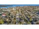 An aerial view showcasing the neighborhood with the ocean in the background at 1786 Nevada Ne Ave, St Petersburg, FL 33703
