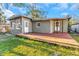 Backyard with a deck, siding, and a lawn at 1786 Nevada Ne Ave, St Petersburg, FL 33703