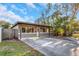 Charming home with a large driveway and lush landscaping, perfect for curb appeal at 1786 Nevada Ne Ave, St Petersburg, FL 33703