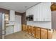 Bright kitchen with new stainless steel microwave and cabinets, ready to be built out at 1786 Nevada Ne Ave, St Petersburg, FL 33703