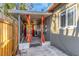 Cozy screened patio featuring decorative orange curtains for added privacy and style at 1786 Nevada Ne Ave, St Petersburg, FL 33703