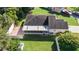 Overhead view of house, showing backyard and screened porch at 38753 Feathering Way, Zephyrhills, FL 33542