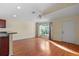 Spacious living room featuring hardwood floors and ceiling fan at 38753 Feathering Way, Zephyrhills, FL 33542