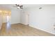 Spacious living room featuring light walls and wood-look floors at 3925 Shoreside Cir, Tampa, FL 33624