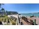 Picturesque beach view with lounge chairs and tiki umbrellas, providing a serene waterfront atmosphere for relaxation at 6061 Bahia Del Mar Cir # 241, St Petersburg, FL 33715