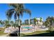 Community pool provides relaxation and recreation with water views, lounging, and palm tree accents at 6061 Bahia Del Mar Cir # 241, St Petersburg, FL 33715