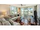 Relaxing living area opens to a balcony with amazing water views and comfortable outdoor seating at 6061 Bahia Del Mar Cir # 241, St Petersburg, FL 33715