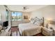 Cozy main bedroom with hardwood floors, relaxing natural light, and serene water views at 6061 Bahia Del Mar Cir # 241, St Petersburg, FL 33715