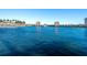 Breathtaking view of the lake featuring a fountain and multiple residential buildings in the community at 6061 Bahia Del Mar Cir # 241, St Petersburg, FL 33715