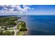 Aerial view of waterfront homes and boats at 611 Maryland Ave, Crystal Beach, FL 34681