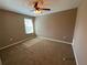 Bright bedroom with carpeted floor and ceiling fan at 12217 Swaying Moss Cir, Riverview, FL 33569