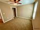 Spacious bedroom with carpeted floor and a large closet at 12217 Swaying Moss Cir, Riverview, FL 33569