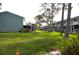 Exterior view of the condo complex featuring well-maintained lawns and lush landscaping at 117 114Th N Ave # 117, St Petersburg, FL 33716