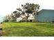 Exterior of condo complex with carports and spacious green lawns at 117 114Th N Ave # 117, St Petersburg, FL 33716