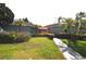 The exterior of the community building showcases fresh landscaping at 117 114Th N Ave # 117, St Petersburg, FL 33716