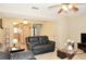 Inviting living room featuring tile floors, a ceiling fan, and comfortable seating, perfect for relaxation at 117 114Th N Ave # 117, St Petersburg, FL 33716