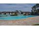 Community pool with chairs and building views at 117 114Th N Ave # 117, St Petersburg, FL 33716