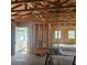 Interior under construction, showing framing and door at 5831 Michigan Ave, New Port Richey, FL 34652