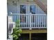 New home features a back patio with white railing and french doors at 5831 Michigan Ave, New Port Richey, FL 34652