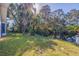 Backyard oasis with canal view and lush landscaping at 989 Virginia St, Dunedin, FL 34698