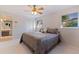 Large main bedroom with carpeted floor and ceiling fan at 989 Virginia St, Dunedin, FL 34698