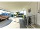 Covered patio with seating area and partial view of the street at 37827 Mission Hills Ave, Zephyrhills, FL 33541