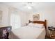 Bright bedroom with a comfortable double bed at 37827 Mission Hills Ave, Zephyrhills, FL 33541