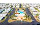 Aerial view of community clubhouse, pool, and surrounding parking lot at 37827 Mission Hills Ave, Zephyrhills, FL 33541