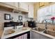 Kitchen area with stove, sink, and ample counter space at 37827 Mission Hills Ave, Zephyrhills, FL 33541