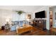Living room with hardwood floors, fireplace, and built-in shelving at 37827 Mission Hills Ave, Zephyrhills, FL 33541