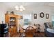 Dining area with wood table and chairs, and built-in hutch at 37827 Mission Hills Ave, Zephyrhills, FL 33541