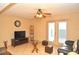 Living room with tiled floors, TV, and glass coffee table at 117 114Th N Ave # 117, St Petersburg, FL 33716