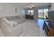 Living area with sectional sofa and view of lake at 928 Royal Empress Dr, Ruskin, FL 33570