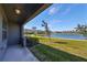 Covered patio overlooking a peaceful lake at 928 Royal Empress Dr, Ruskin, FL 33570