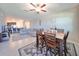 Bright dining area with wood table and chairs,open to living room and kitchen at 928 Royal Empress Dr, Ruskin, FL 33570