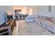 Open concept living room with sectional sofa and kitchen views at 928 Royal Empress Dr, Ruskin, FL 33570