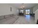 Living room with sectional sofa and view of backyard lake at 928 Royal Empress Dr, Ruskin, FL 33570