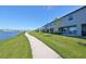 Community lake with walking path and homes at 928 Royal Empress Dr, Ruskin, FL 33570