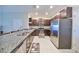 Modern kitchen with stainless steel appliances and granite counters at 928 Royal Empress Dr, Ruskin, FL 33570