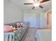 Bright Bedroom with crib, closet, and neutral walls at 928 Royal Empress Dr, Ruskin, FL 33570