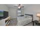 Spacious bedroom with a queen bed and TV at 928 Royal Empress Dr, Ruskin, FL 33570