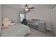 Cozy bedroom with a crib and plenty of space for toys at 928 Royal Empress Dr, Ruskin, FL 33570