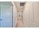 Upstairs hallway with carpet and doors to bedrooms at 928 Royal Empress Dr, Ruskin, FL 33570