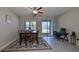 Dining room with table, chairs, and view of lake at 928 Royal Empress Dr, Ruskin, FL 33570