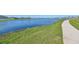 Community lake with walking path and lush landscaping at 928 Royal Empress Dr, Ruskin, FL 33570