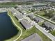 Aerial view of community featuring multiple townhomes near a lake at 928 Royal Empress Dr, Ruskin, FL 33570