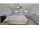 Main bedroom with a king-size bed and lake view at 928 Royal Empress Dr, Ruskin, FL 33570