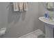 Clean and simple bathroom with pedestal sink at 928 Royal Empress Dr, Ruskin, FL 33570