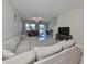 Living room with sectional sofa, water view, and open floor plan at 928 Royal Empress Dr, Ruskin, FL 33570