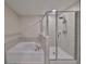 Bathroom with a large walk-in shower and garden tub at 928 Royal Empress Dr, Ruskin, FL 33570